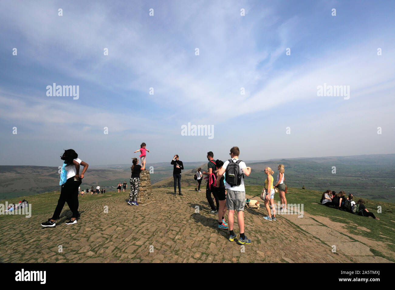 Walkers at Mam Tor Summit Cairn, Vale of Edale, Derbyshire, Peak District National Park, England Stock Photo