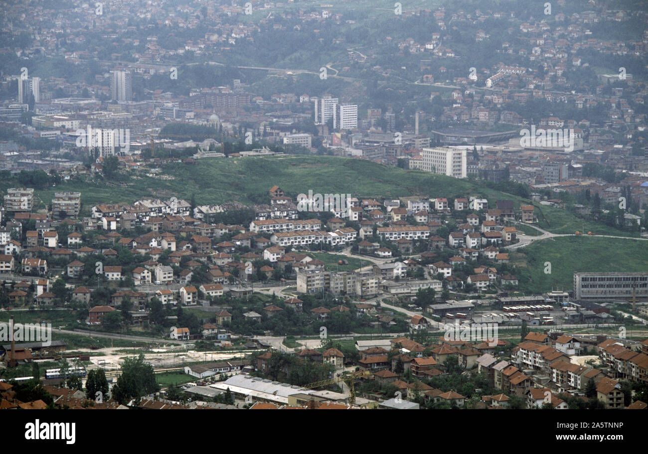 6th June 1993 During the Siege of Sarajevo: the view south-east from Hum Hill. The Mirza Delibašić Hall (Skenderija Hall) is on the right, immediately above the white tower-block of the Dr Abdulah Nakas General Hospital or City Hospital, known locally as the French Hospital. Stock Photo