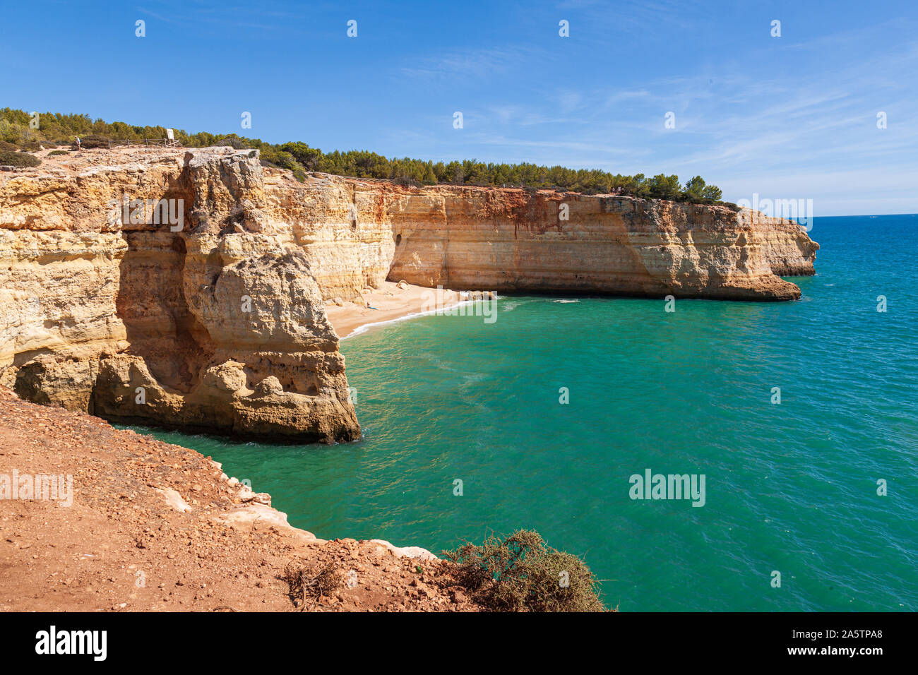 view of the algarve coastline late summer rocky outcrops sea caves and cliffs Stock Photo