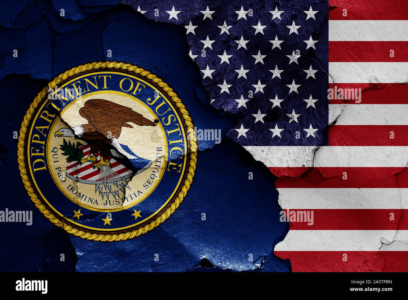 flags of Department of Justice and USA painted on cracked wall Stock Photo