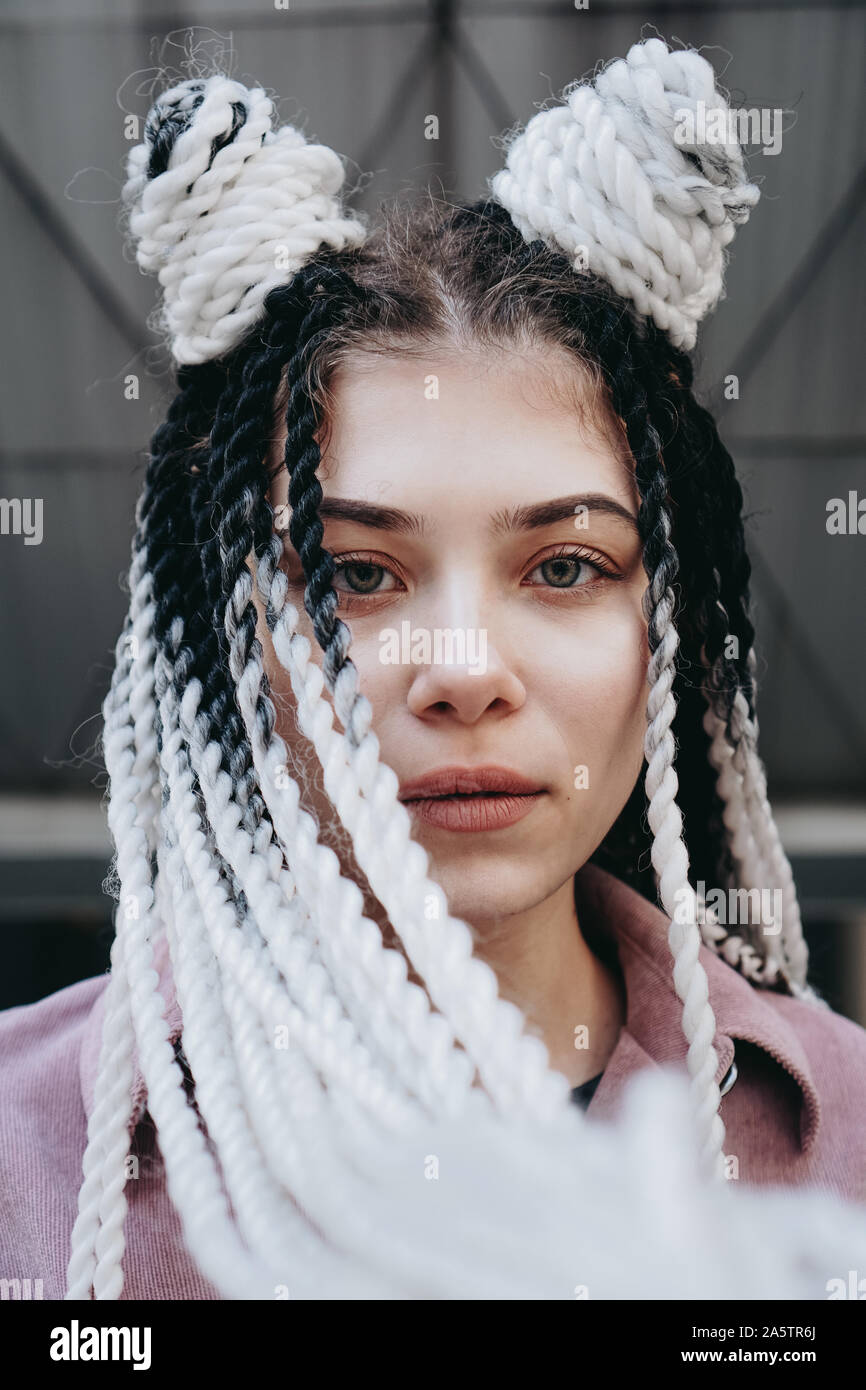 Young Woman With Futuristic Looks Girl With Black And White Dreadlocks Or Pigtails Against The Background Of A Futuristic Building Stock Photo Alamy Young Woman With Futuristic Looks Girl With Black And White Dreadlocks Or Pigtails Against The Background Of A Futuristic Building Stock Photo Alamy