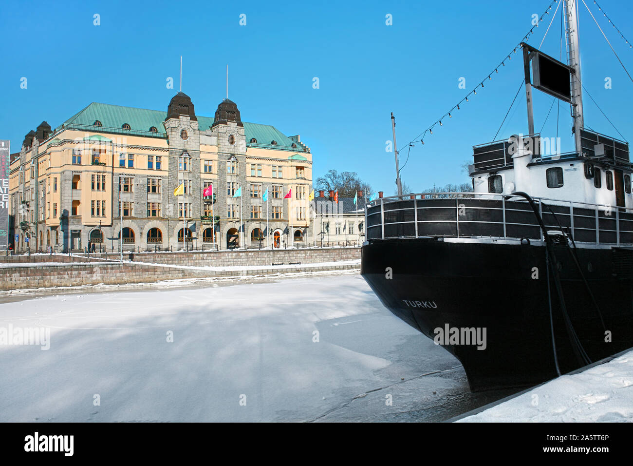 Turku, Finland. Embankment of the river Aura on a winter with blue sky and snow. Stock Photo