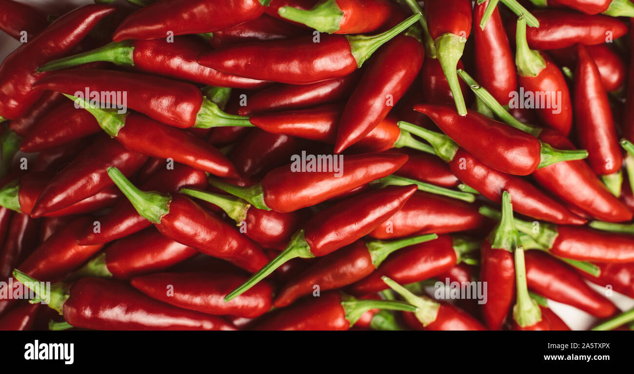 Pile of Fresh Chili and Ripe Red Hot Chili. Top view. Chili Saltillo (Capsicum Annum) Stock Photo