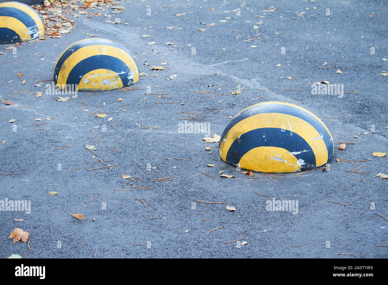 black-and-yellow-parking-hemispheres-indicate-parking-spot-selective