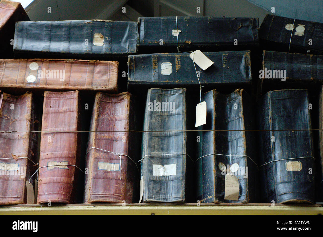 Accounting. Old stock-books on a shelf in an English 19th century textile factory. Stock Photo