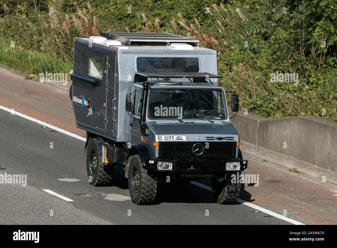 A Mercedes Benz Unimog traveling southbound on ther M6 motorway near Preston in Lancashire, UK Stock Photo