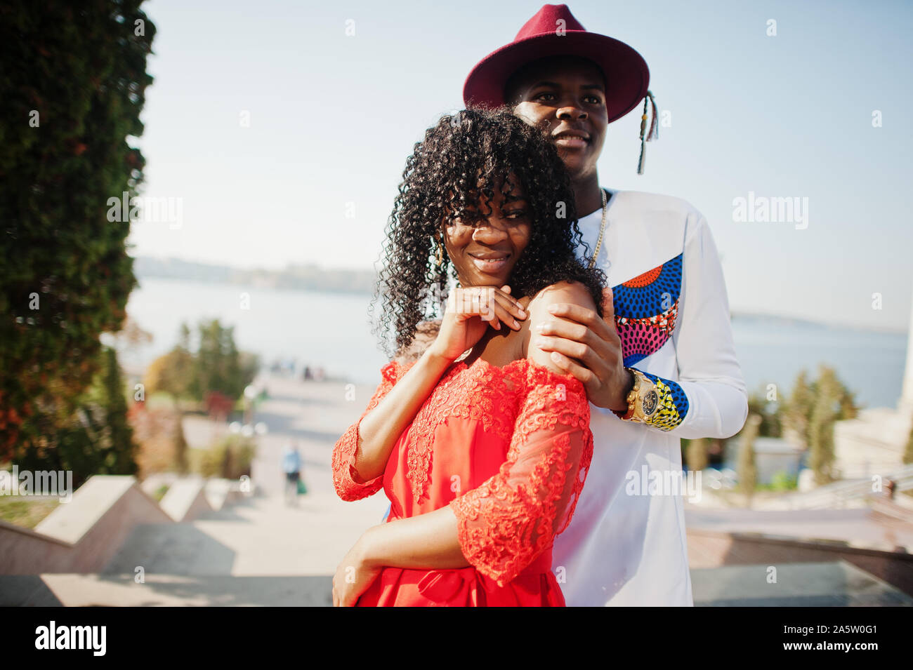 Stylish trendy afro france couple posed together at autumn day. Black african models in love. Stock Photo