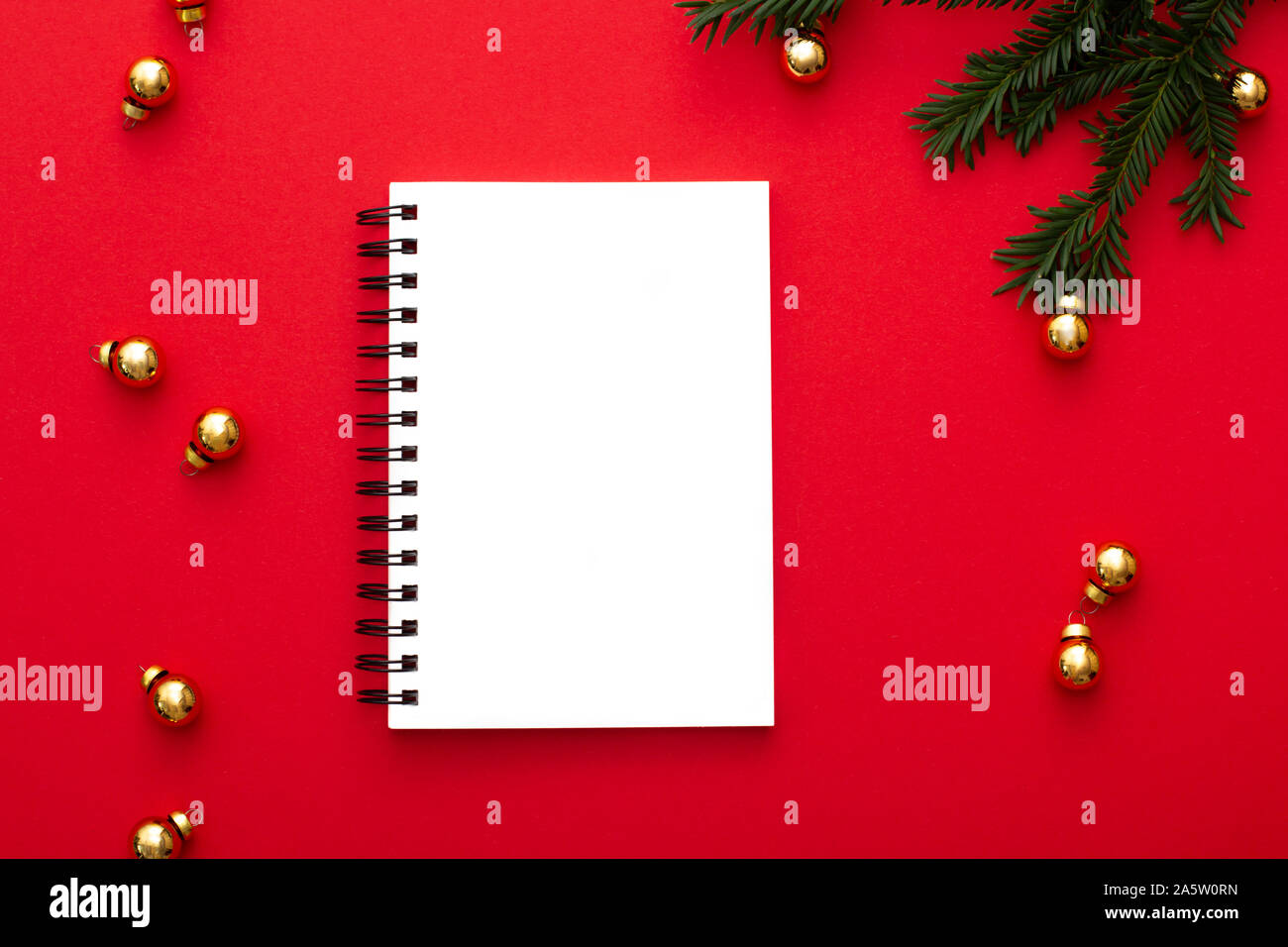 Notebook White Mockup On Red Background With Golden Christmas