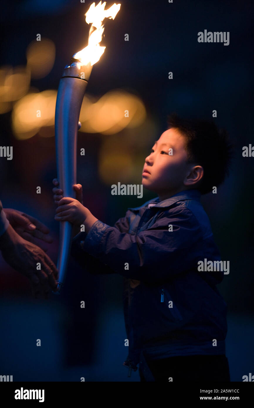 Boy carrying the torch hires stock photography and images Alamy