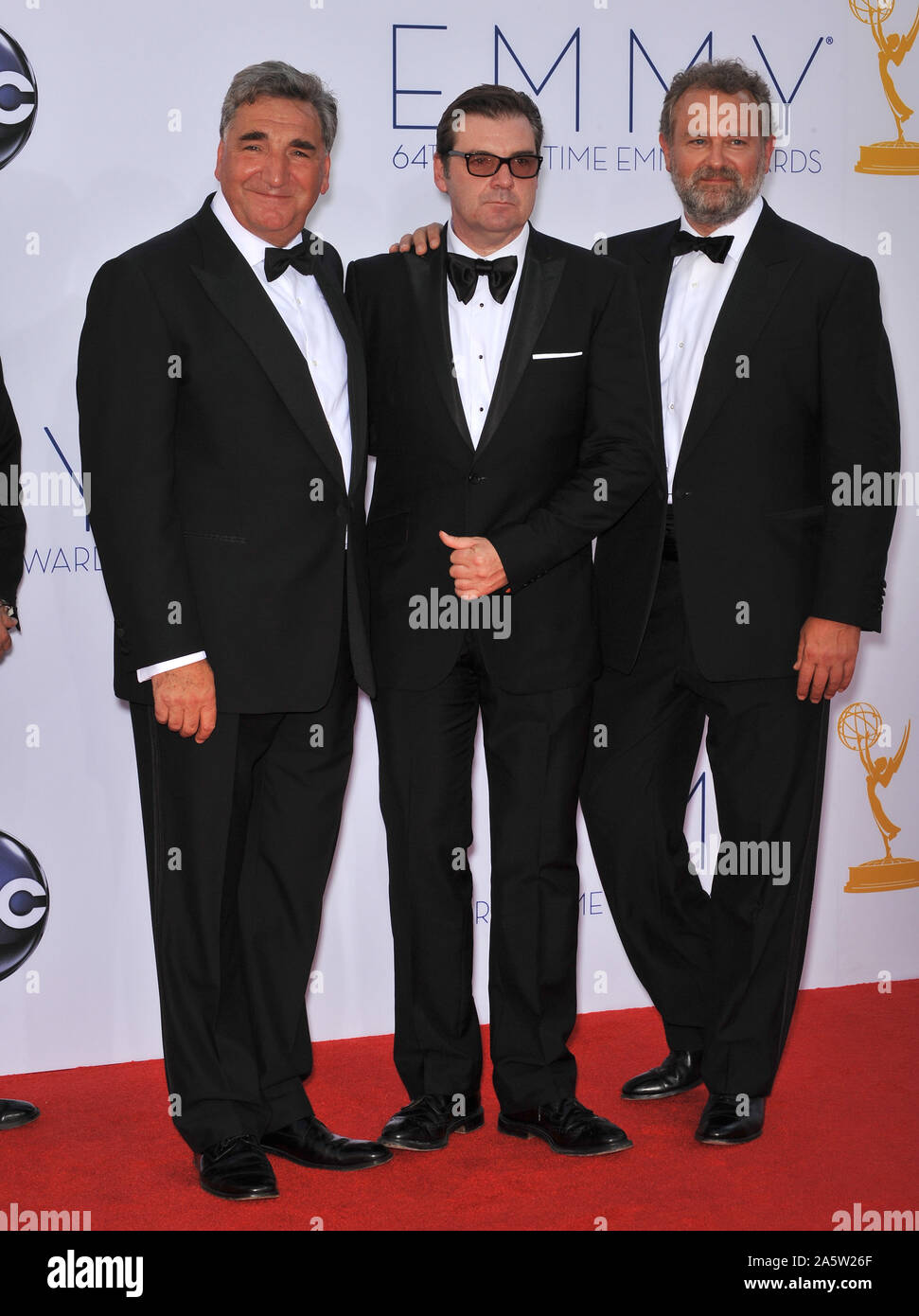 LOS ANGELES, CA. September 23, 2012: Downton Abbey stars Hugh Bonneville, Brendan Coyle & Jim Carter at the 64th Primetime Emmy Awards at the Nokia Theatre LA Live. © 2012 Paul Smith / Featureflash Stock Photo