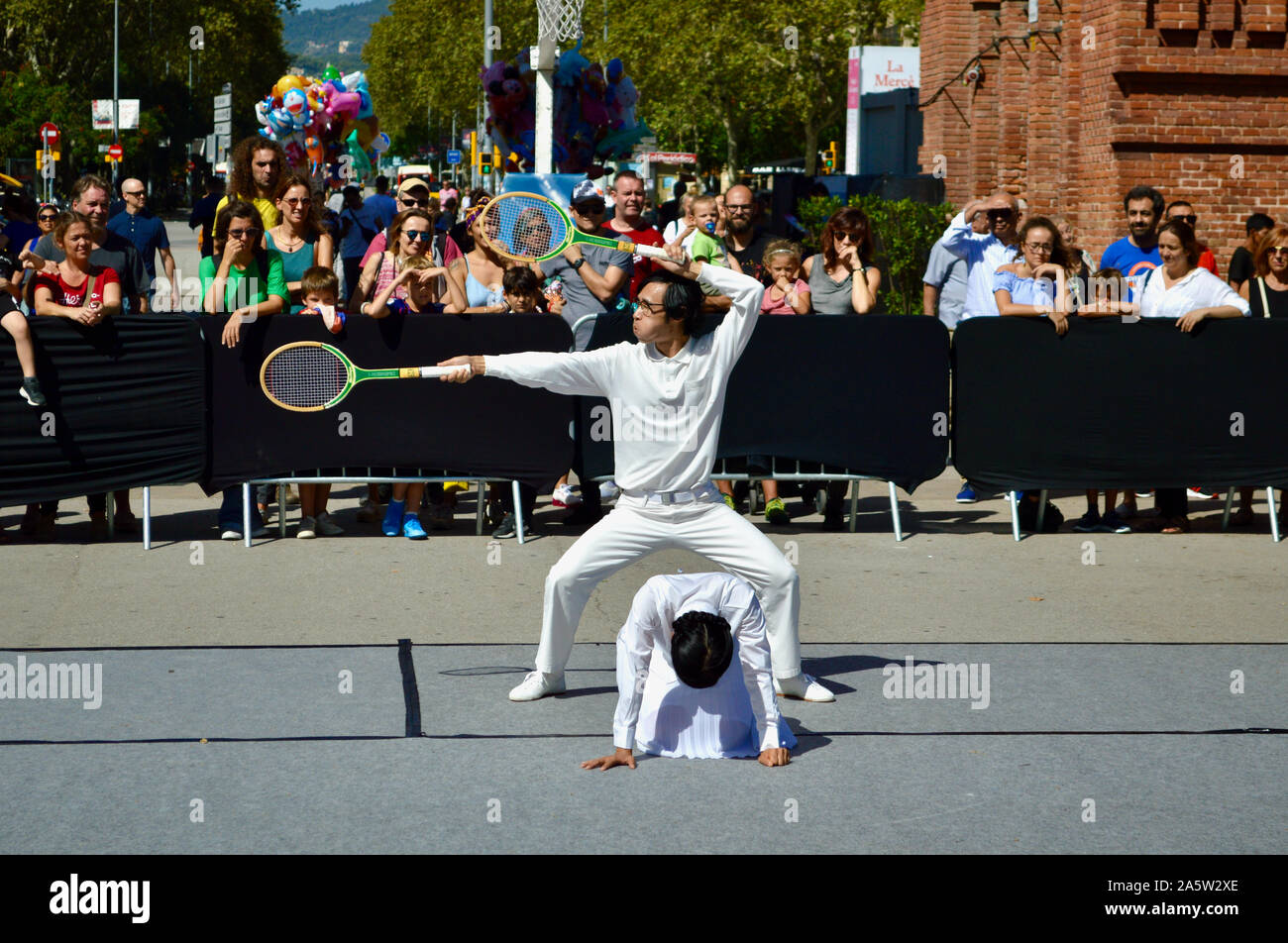 A couple of street artists performing at Ciutadella Park during La Merce 2019 in Barcelona, Spain Stock Photo