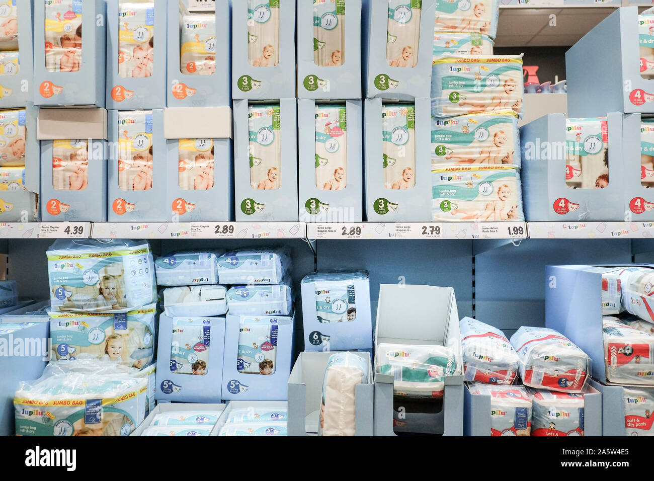 Packets and boxes of nappies on sale in a Lidl supermarket. Stock Photo