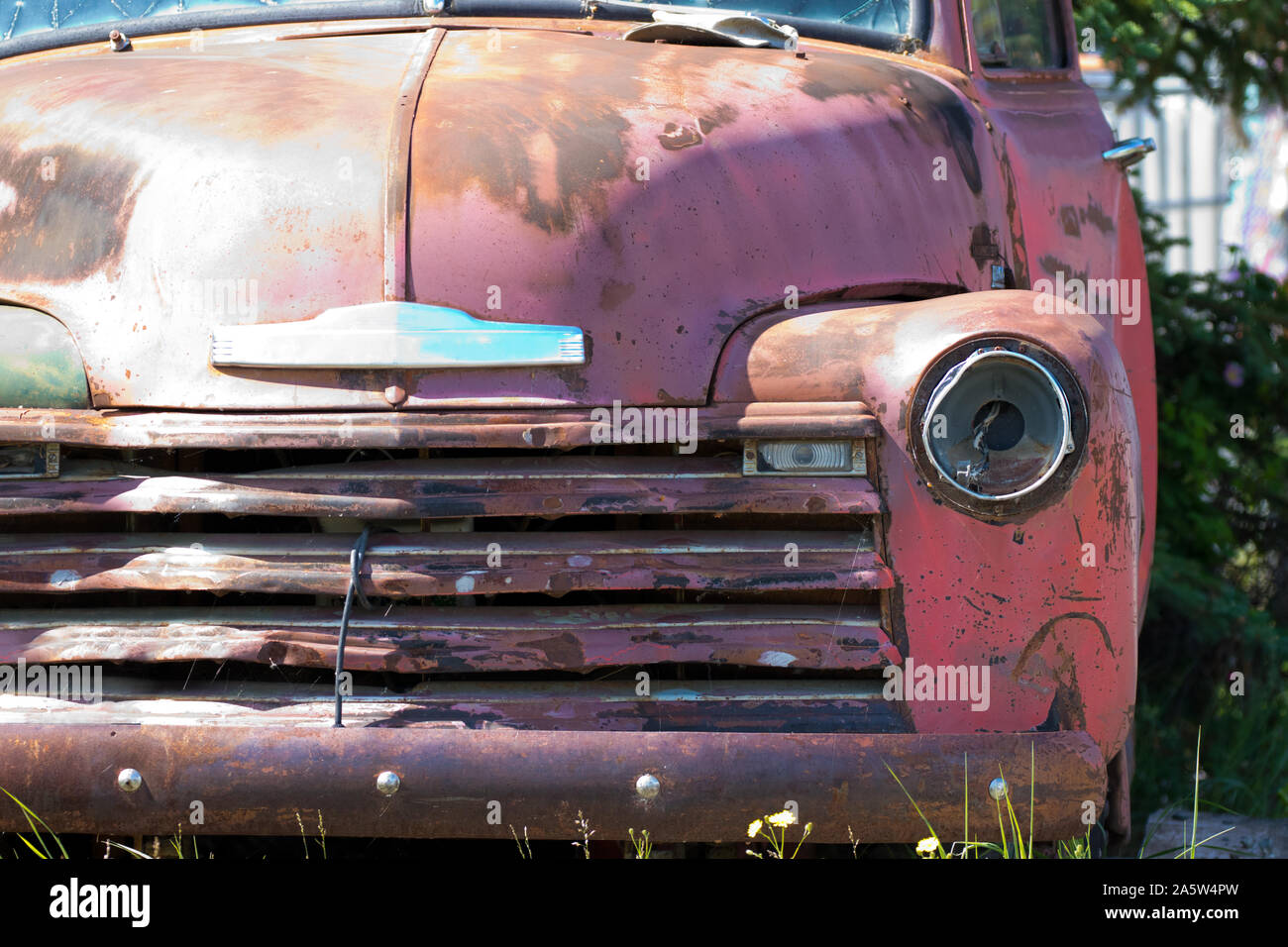 Close up isolated view of an old abandoned rusting pickup truck. Stock Photo