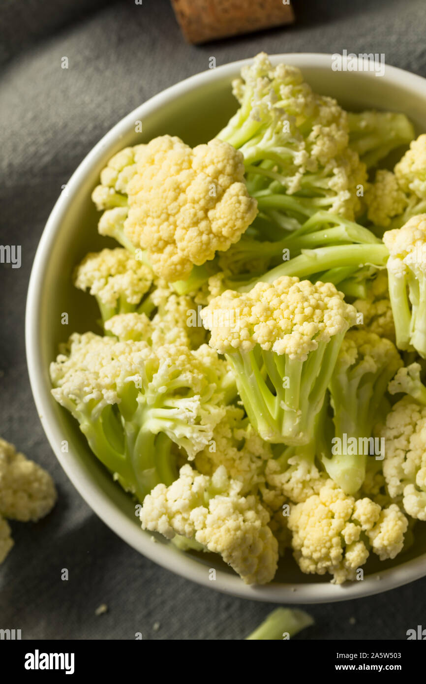 Raw White Baby Cauliflower Florets in a Bowl Stock Photo