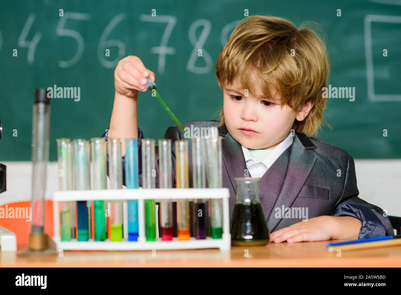 little boy at lesson. Back to school. biology science. science experiments in lab. Little boy is