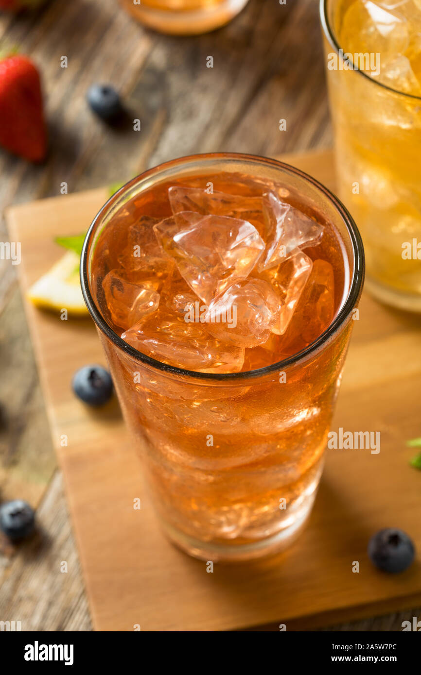 Cool Refreshing Flavored Berry Iced Teas with Lemon and Mint Stock Photo