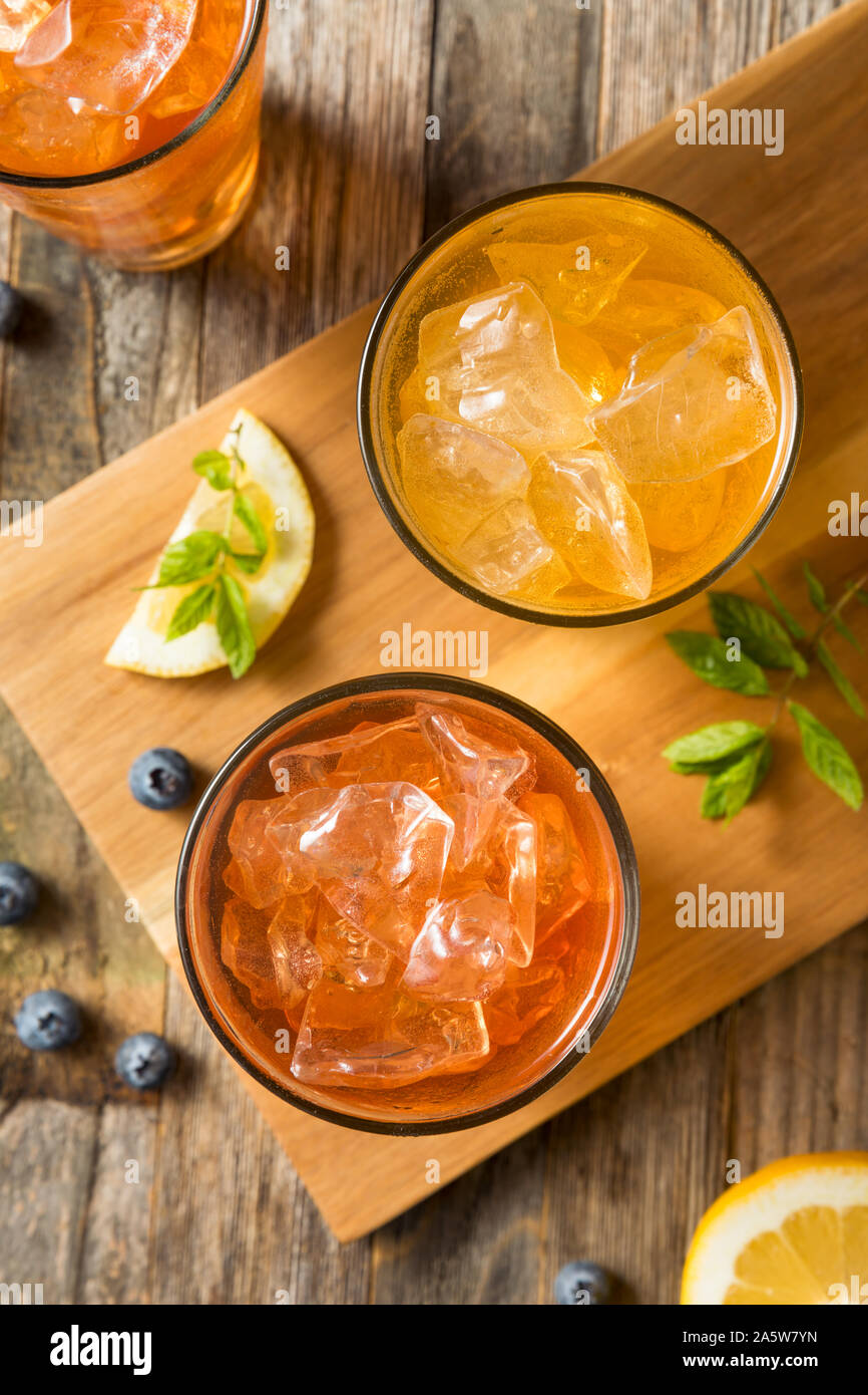 Cool Refreshing Flavored Berry Iced Teas with Lemon and Mint Stock Photo