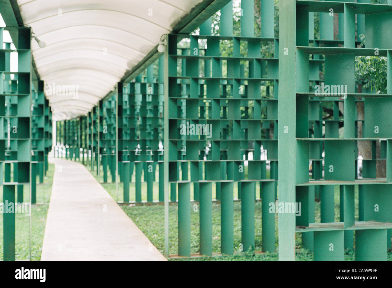 Walkway surrounded by green steel structure and dome. Made on 35mm film. Stock Photo