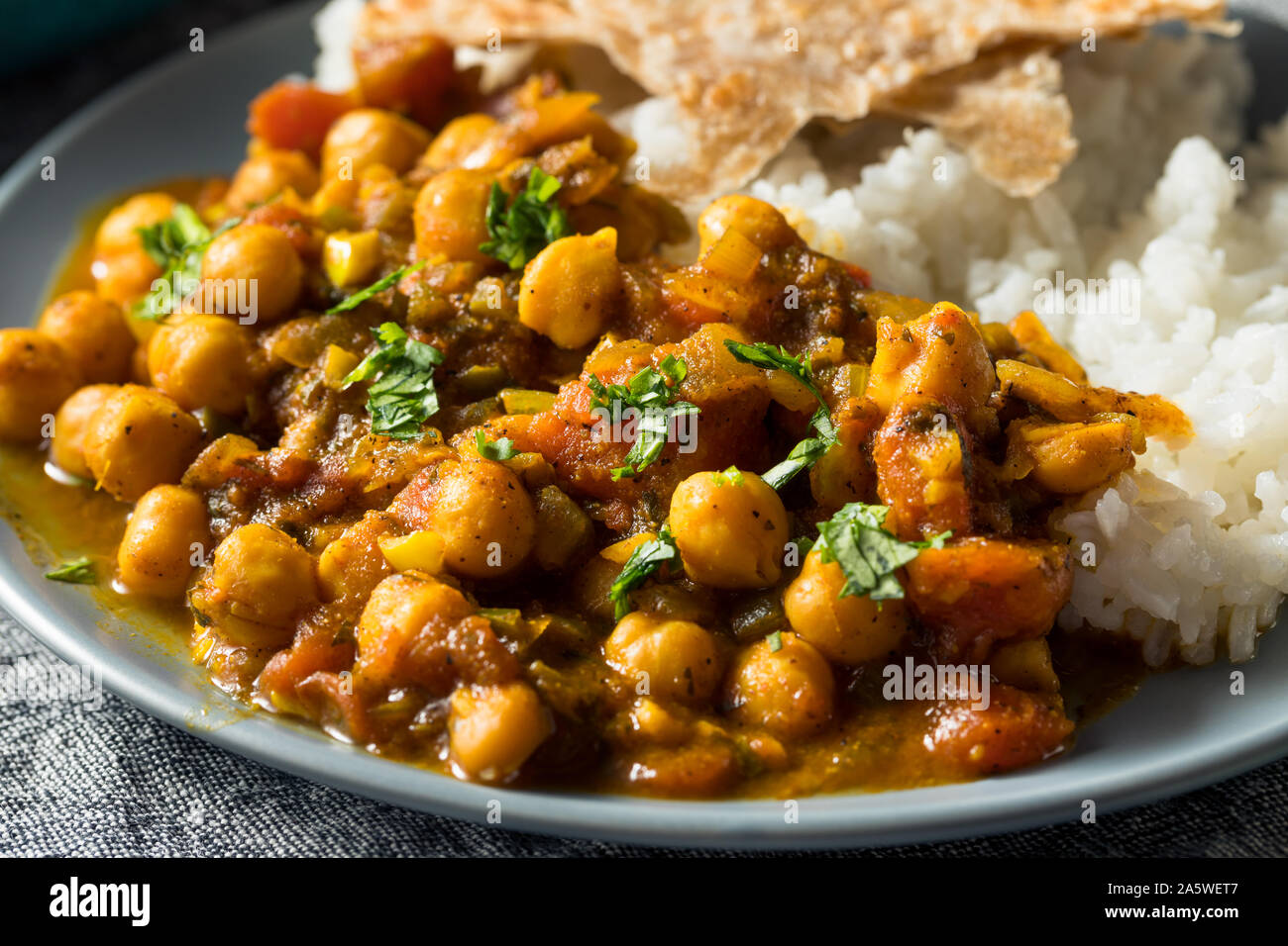 Homemade Indian Chickpea Chana Masala with Rice and Roti Stock Photo ...
