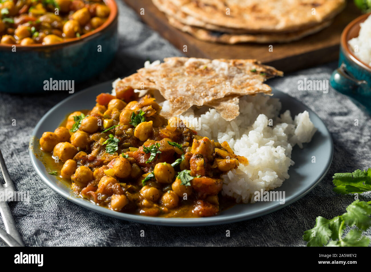 Homemade Indian Chickpea Chana Masala with Rice and Roti Stock Photo ...