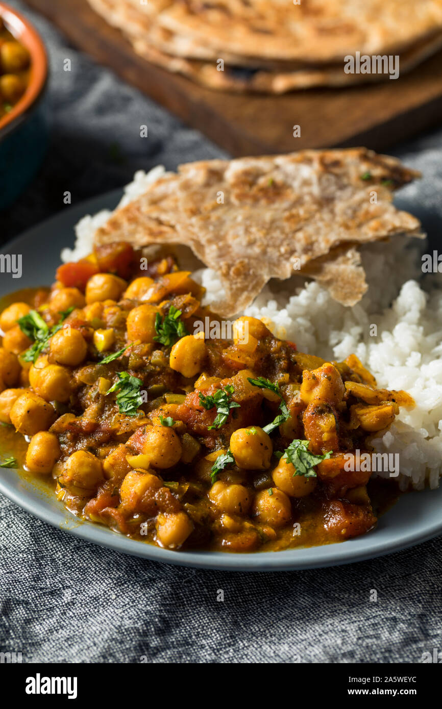 Homemade Indian Chickpea Chana Masala with Rice and Roti Stock Photo ...