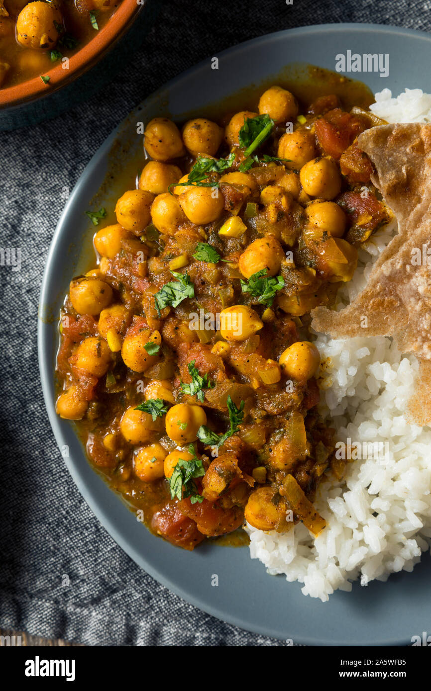 Homemade Indian Chickpea Chana Masala with Rice and Roti Stock Photo ...