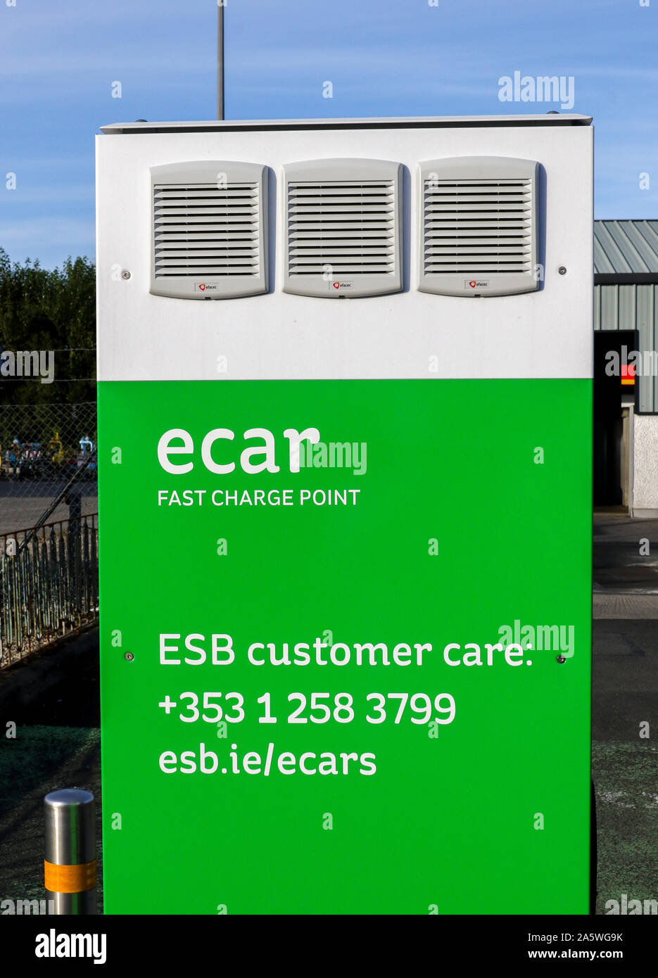 Exterior of an e car fast charge point coloured green and white in