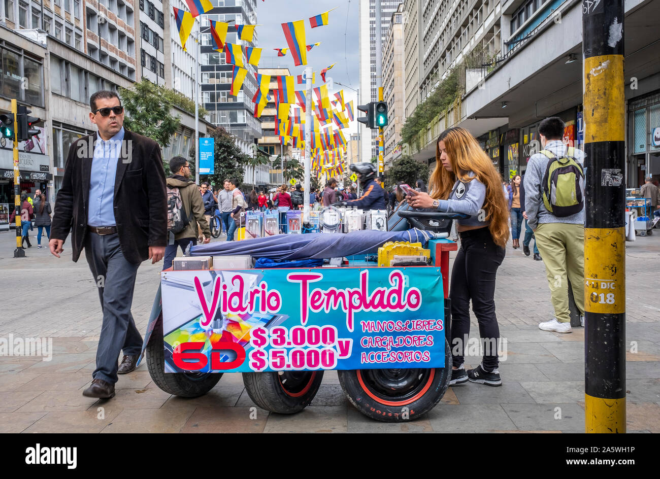 Street vendor of cell phone accessories, Carrera 7 or Carrera septima, Bogota, Colombia Stock Photo