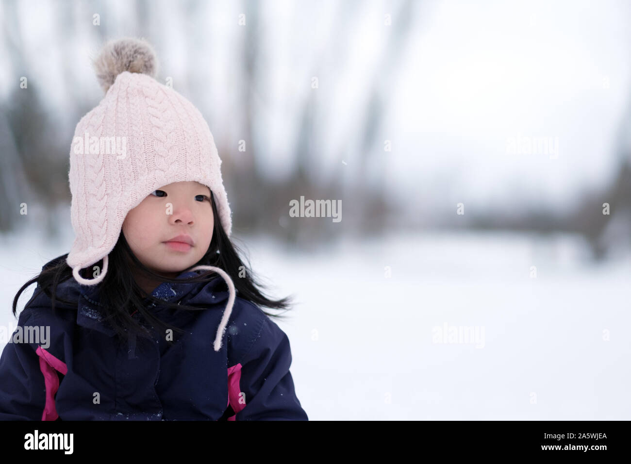 Winter portrait of little child girl wearing knitted hat Stock Photo ...