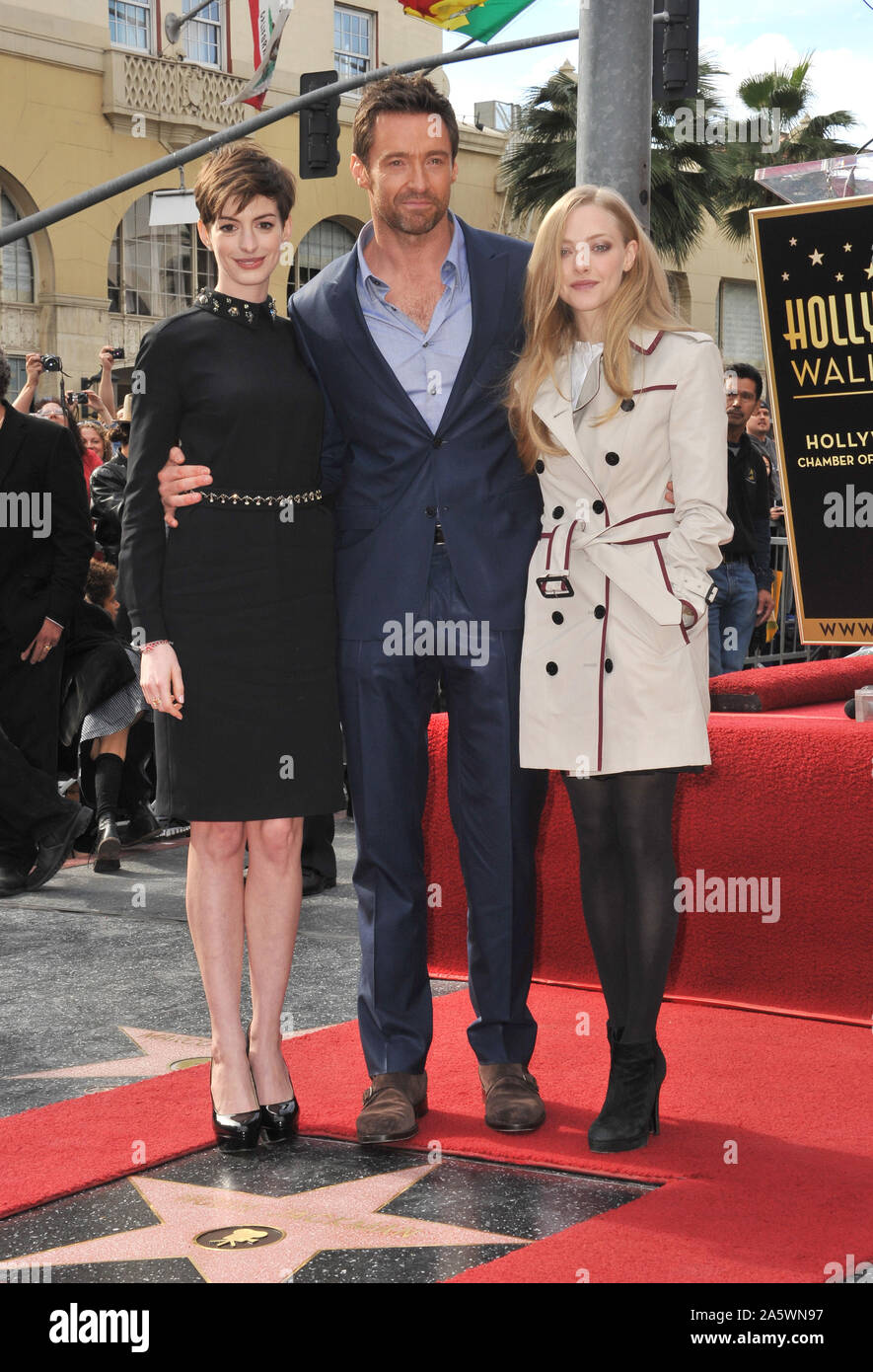 LOS ANGELES, CA. December 13, 2012: Hugh Jackman with his Les Miserable co-stars Anne Hathaway (left) & Amanda Seyfried. Jackman was honored with the 2,487th star on the Hollywood Walk of Fame. © 2012 Paul Smith / Featureflash Stock Photo