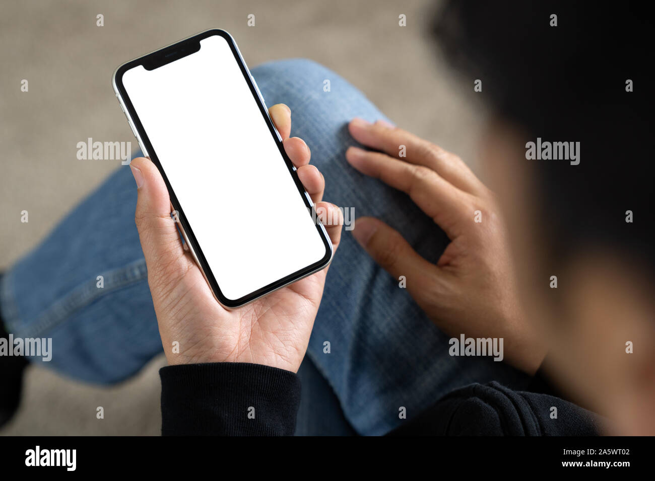 Man using smart phone white screen on top view Stock Photo