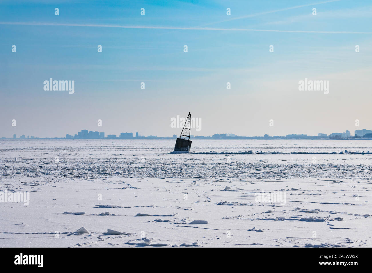 A Buoy in a Frozen Lake Michigan in Chicago after a Polar Vortex Stock Photo
