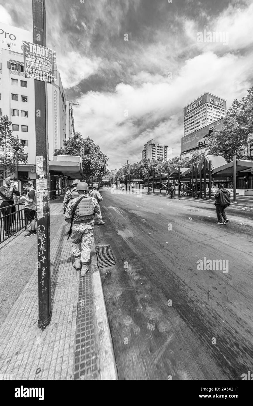 Soldiers in the streets of Santiago during the latest October 2019 riots in the Chilean country. Like a war combat zone the army move across the city Stock Photo
