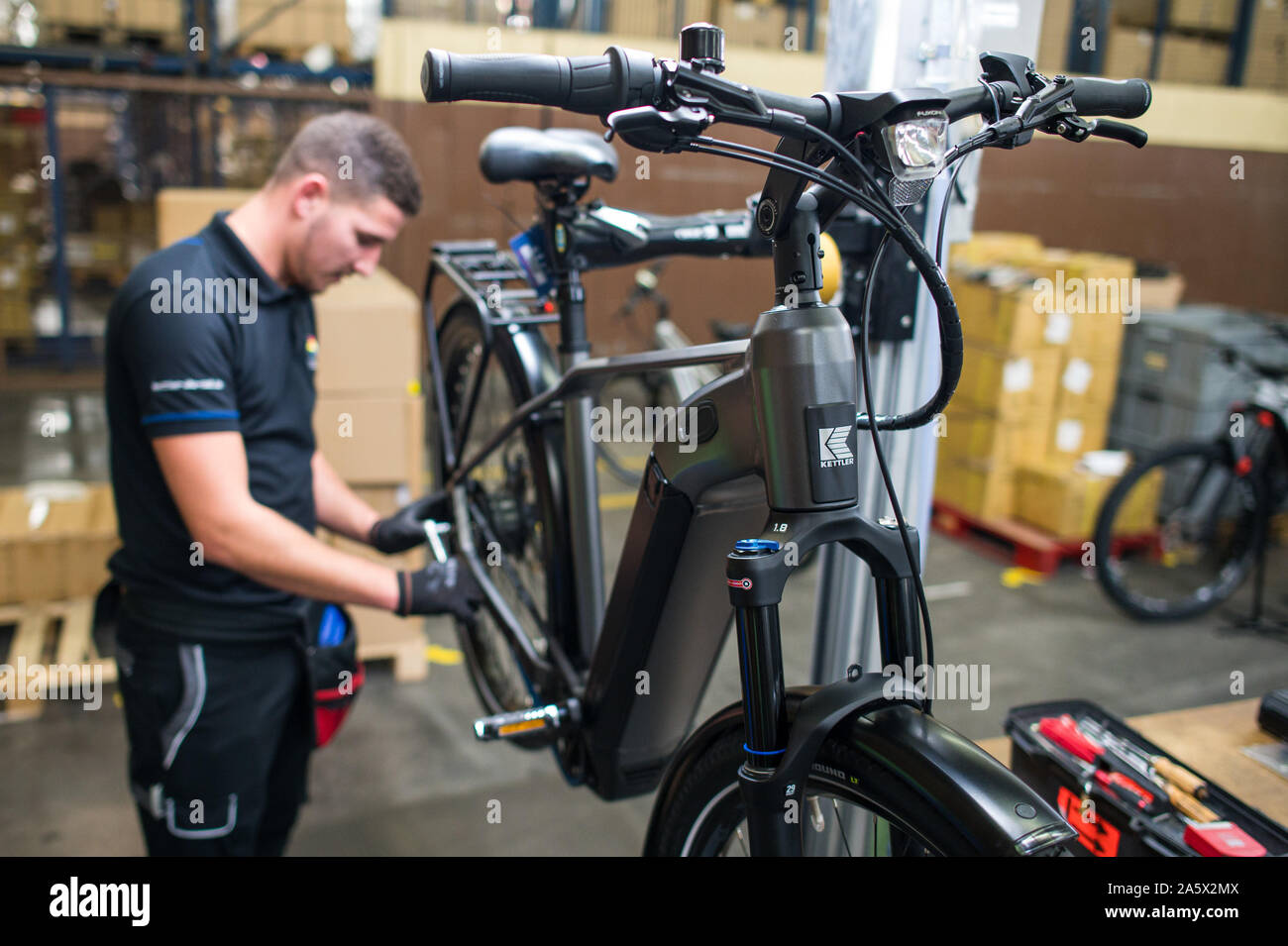 Hanweiler, Germany. 22nd Oct, 2019. An employee of Kettler Alu-Rad checks  an e-bike of Kettler in the final assembly. Consumers trust them. This is  why many brands survive economic crises, technical upheavals