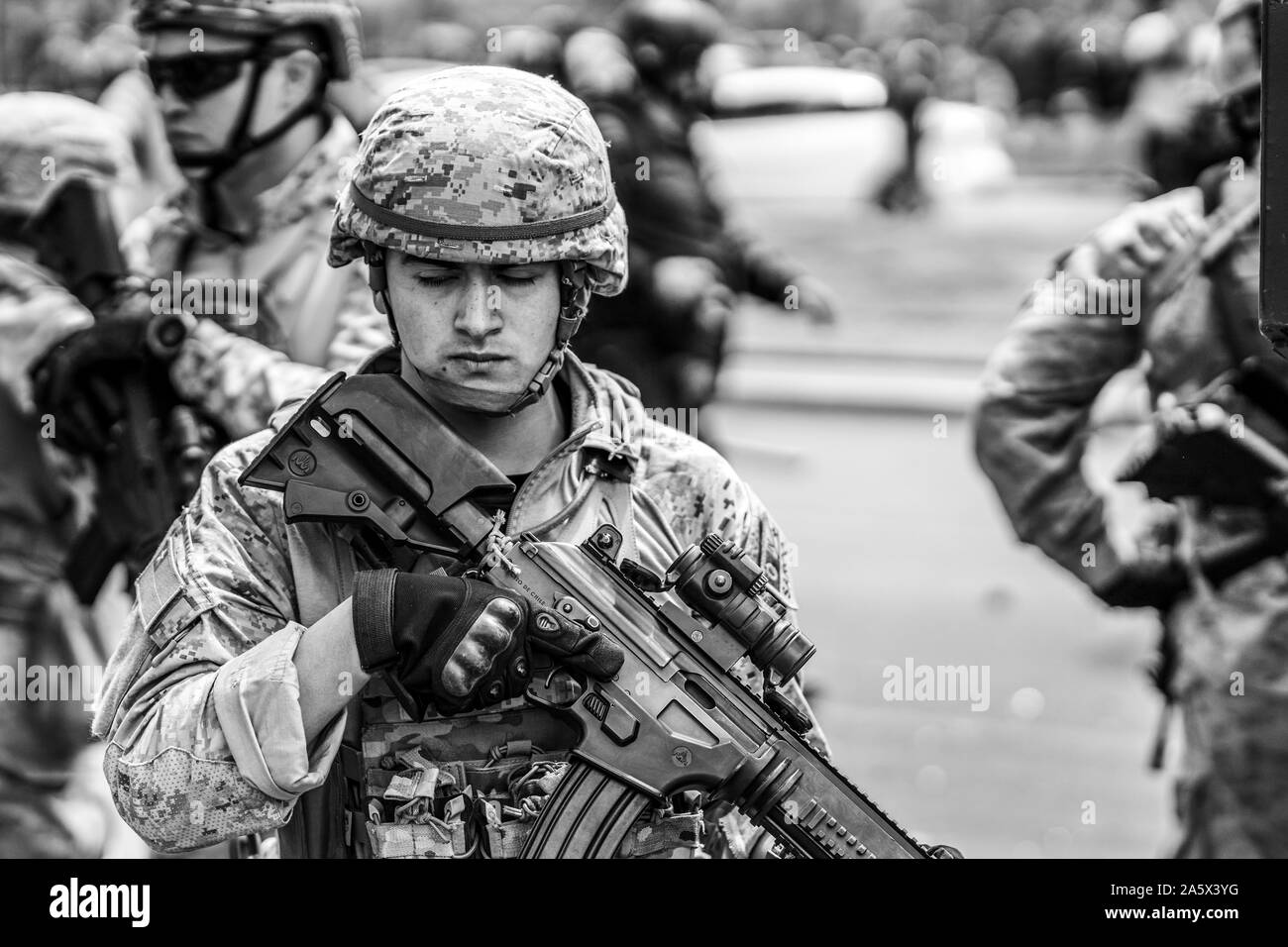 Soldiers in the streets of Santiago during the latest October 2019 riots in the Chilean country. Like a war combat zone the army move across the city Stock Photo