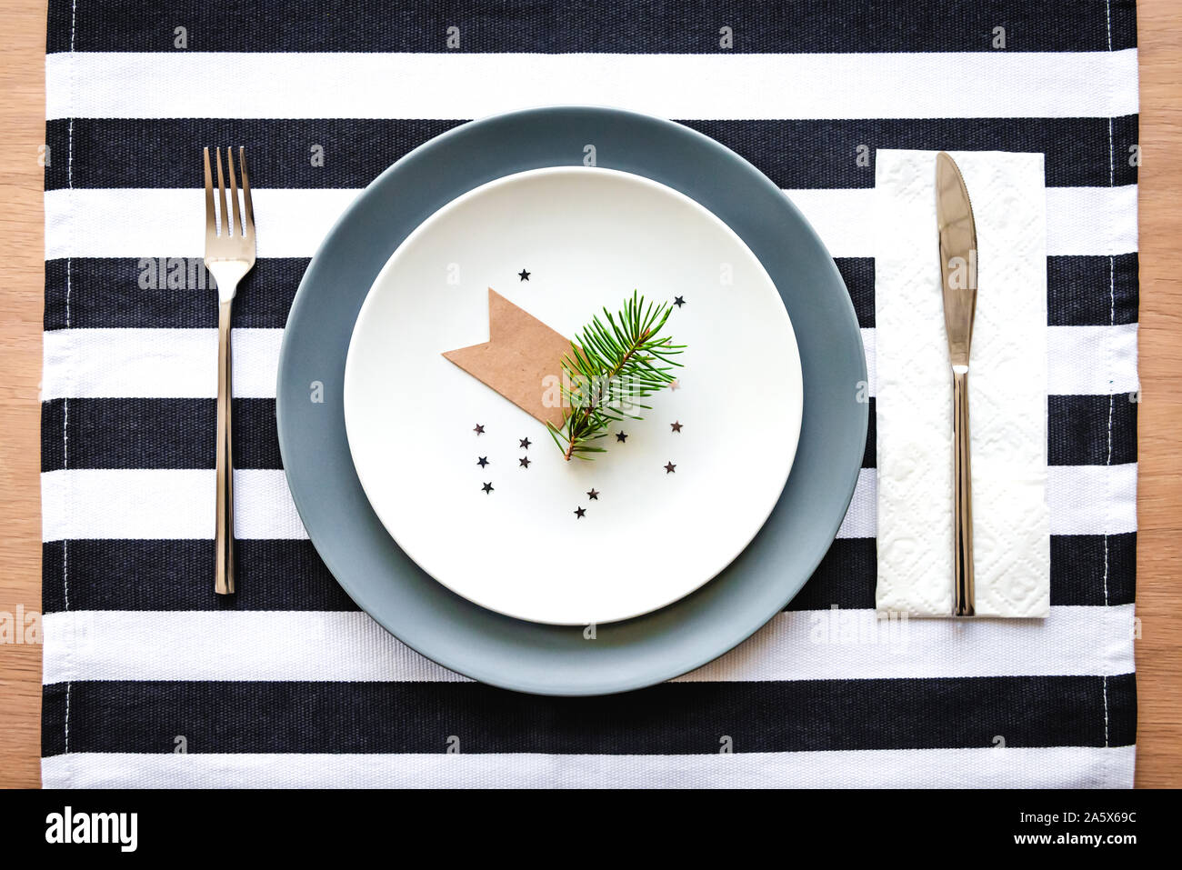 Top view of christmas table setting. Festive plate decoration. Stock Photo