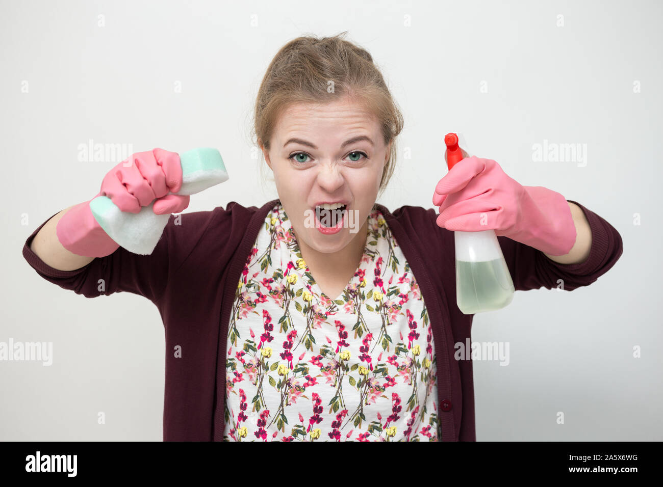 Woman in purple rubber gloves cleaning electric kettle with sponge Stock  Photo - Alamy