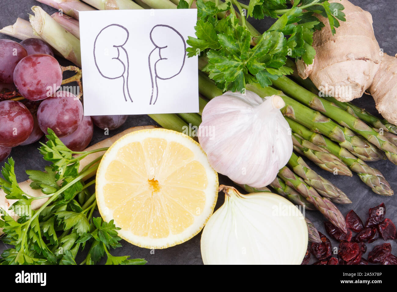 Drawing of kidneys and fresh healthy eating containing natural vitamins