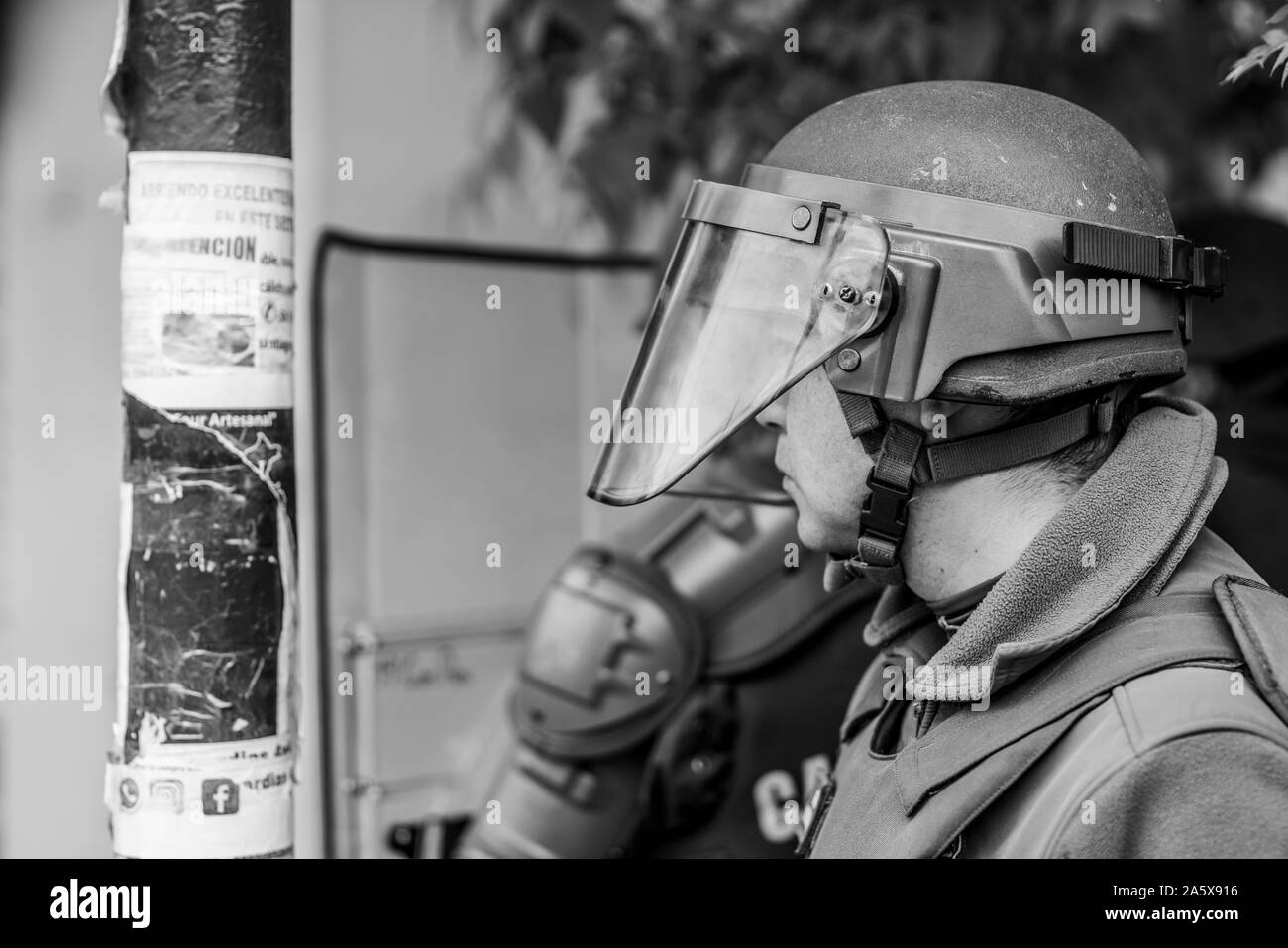 Carabineros portrait during the clashes between the police and protesters at Santiago streets during the latest October 2019 riots at Santiago, Chile Stock Photo