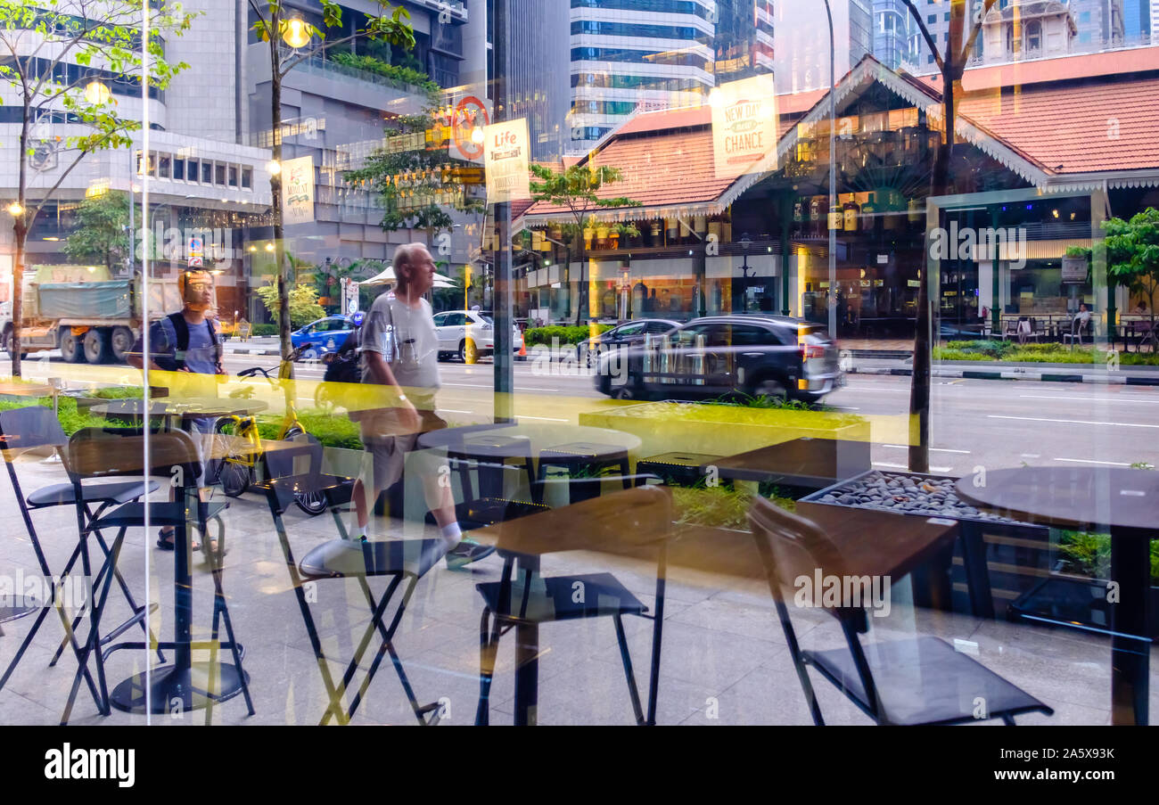 Singapore-14 APR: man walk at Lau Pa Sat food Market street Stock Photo