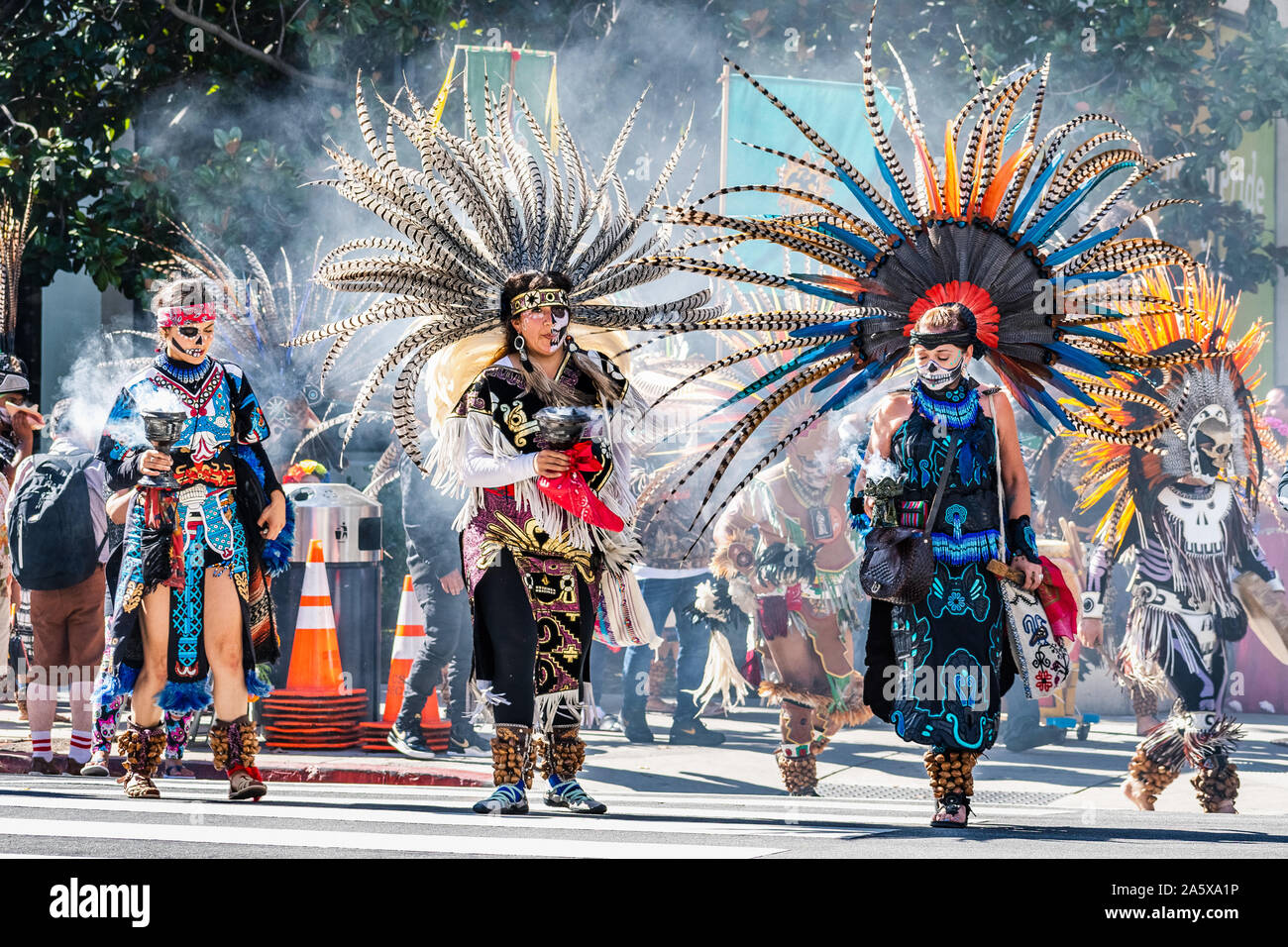 Oct 20, 2019 San Jose / CA / USA - Participants at the Day of the Dead (Dia de Los Muertos) procession carrying offers; Capulli Tonalehqueh Aztec grou Stock Photo