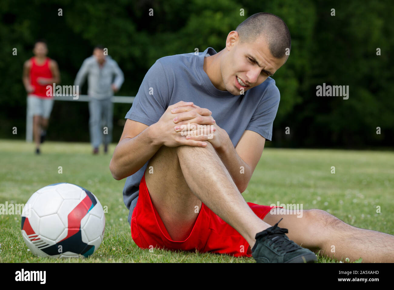 closeup of an injured male soccer player on field Stock Photo Alamy