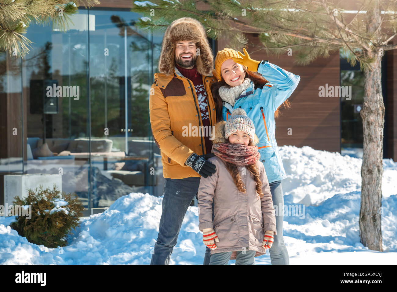 Winter vacation. Family time together outdoors hugging smiling joyful Stock Photo - Alamy