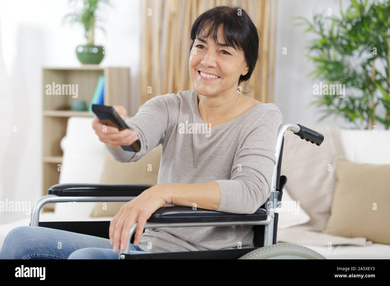 Woman disability watching movie hi-res stock photography and images - Alamy