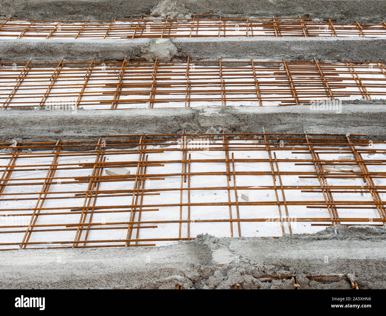 steel grids used with concrete on a construction site to reinforce the