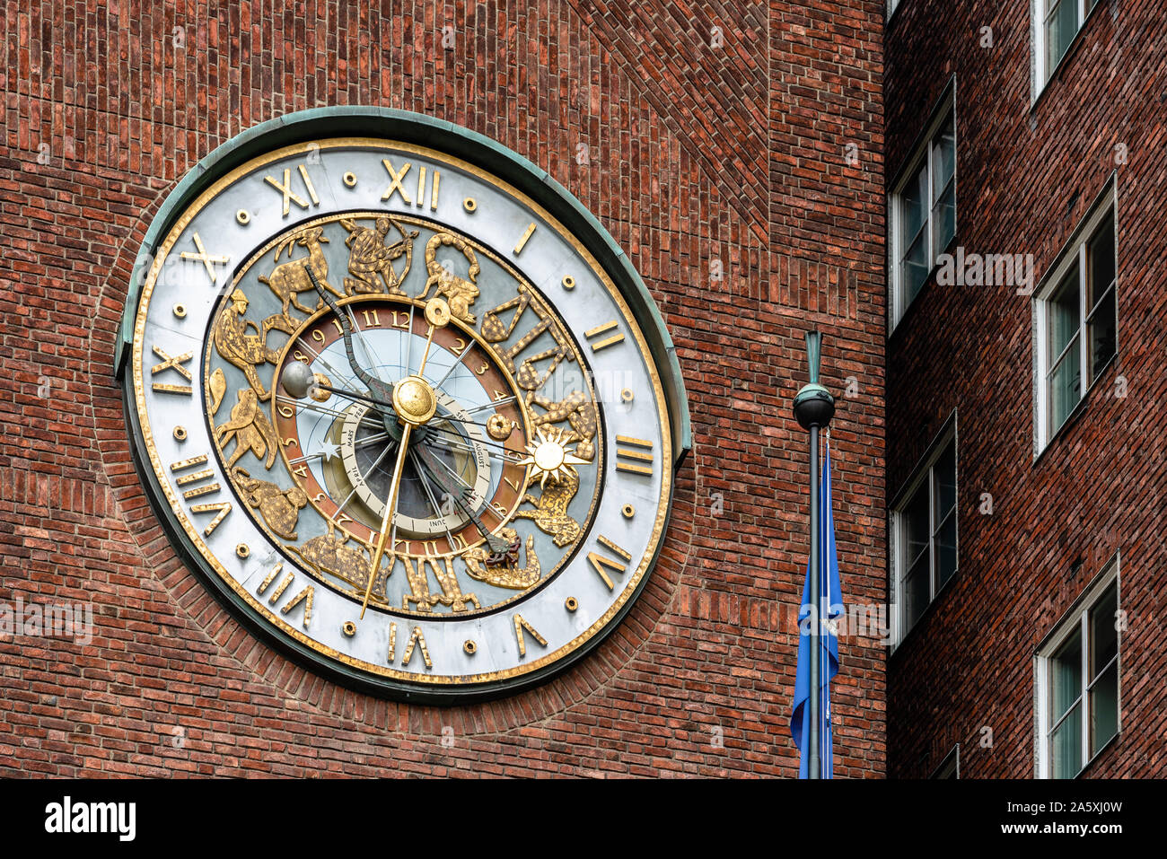 Oslo, Norway - August 11, 2019: The astronomical clock of Oslo City Hall. It houses the city council and it is the seat of the ceromony of Nobel Peace Stock Photo