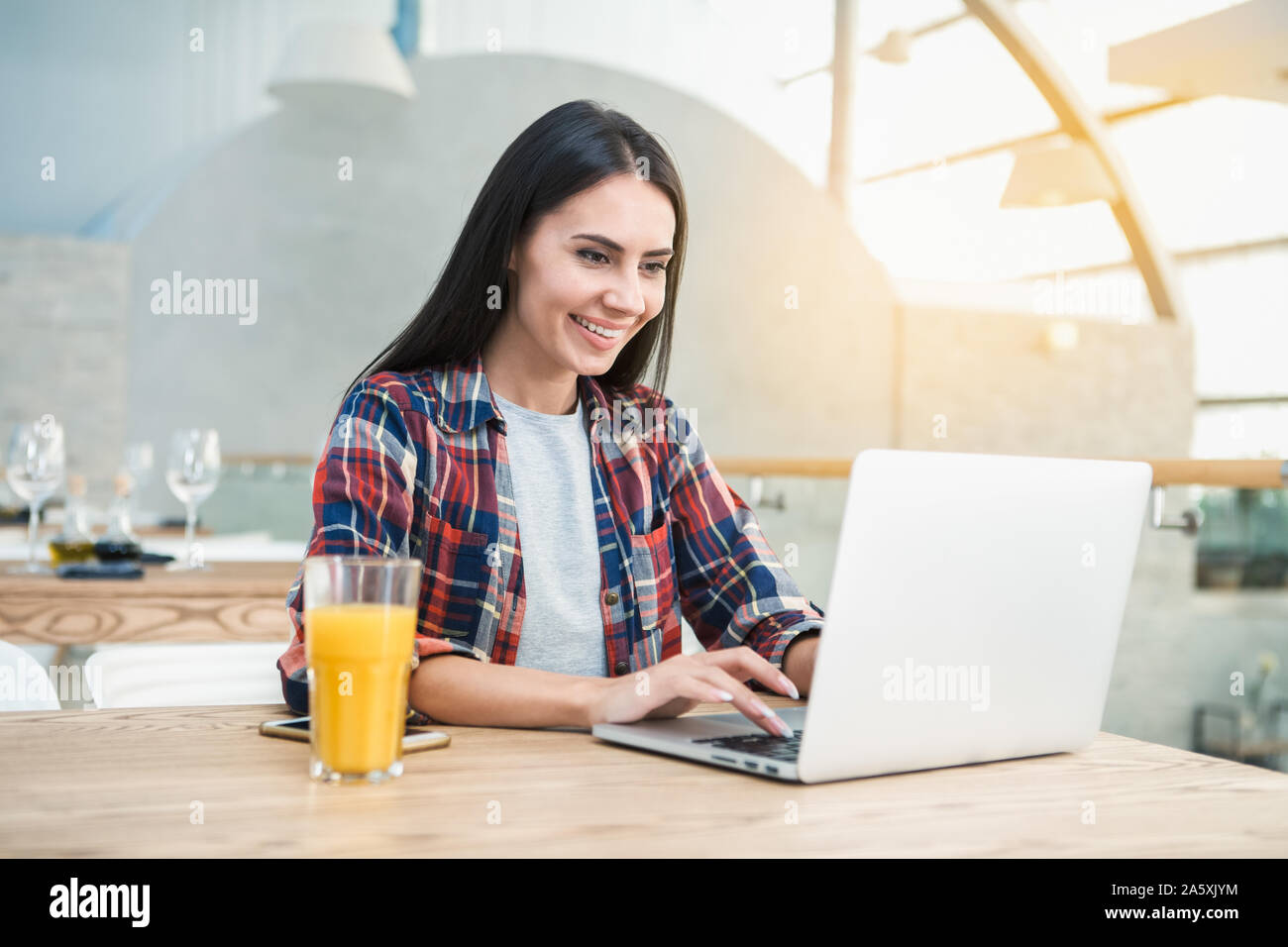 Young Woman Sitting in the Restaurant Browsing Laptop Concept Stock ...