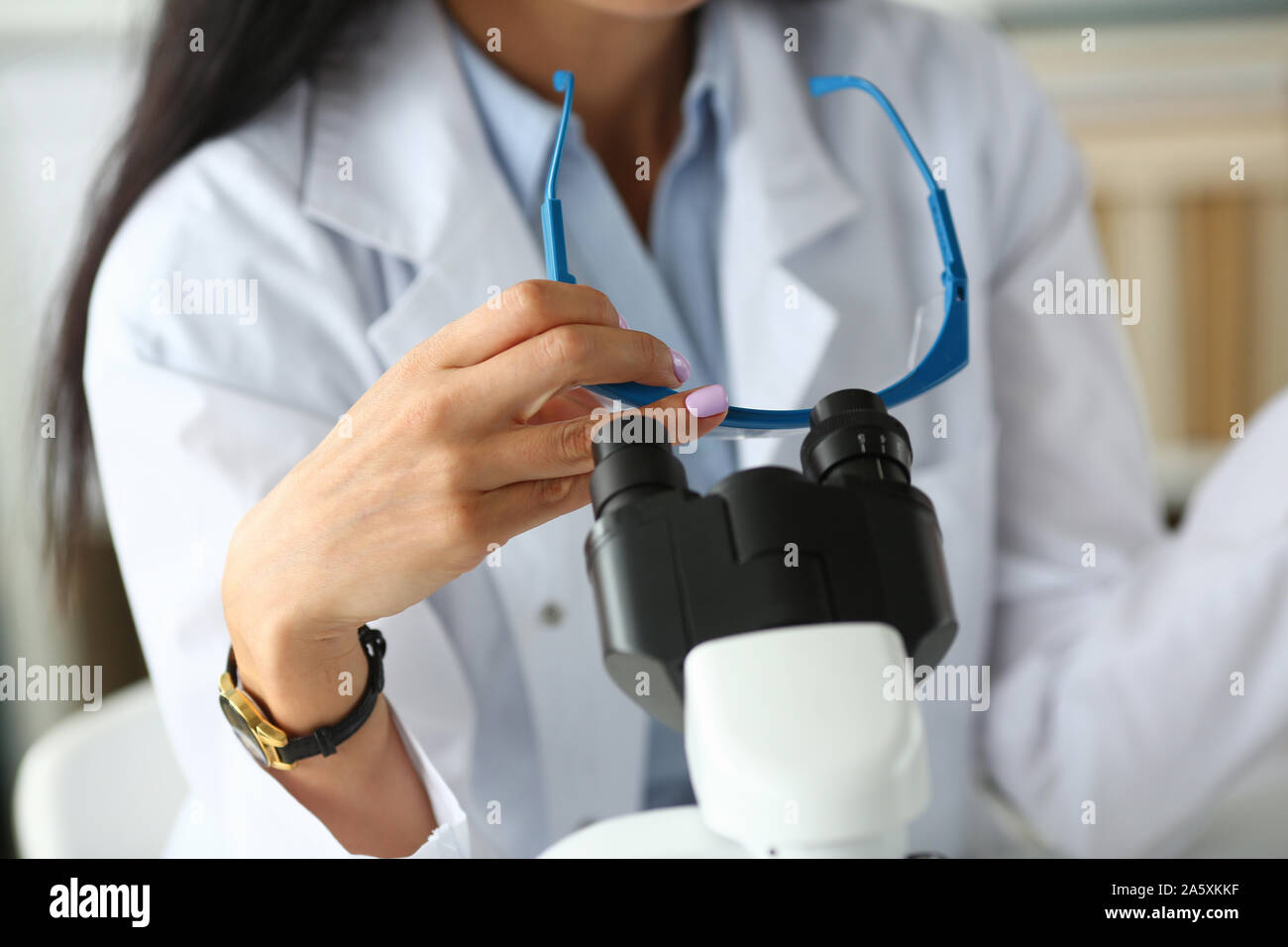 Woman wearing glasses coat hi-res stock photography and images - Alamy