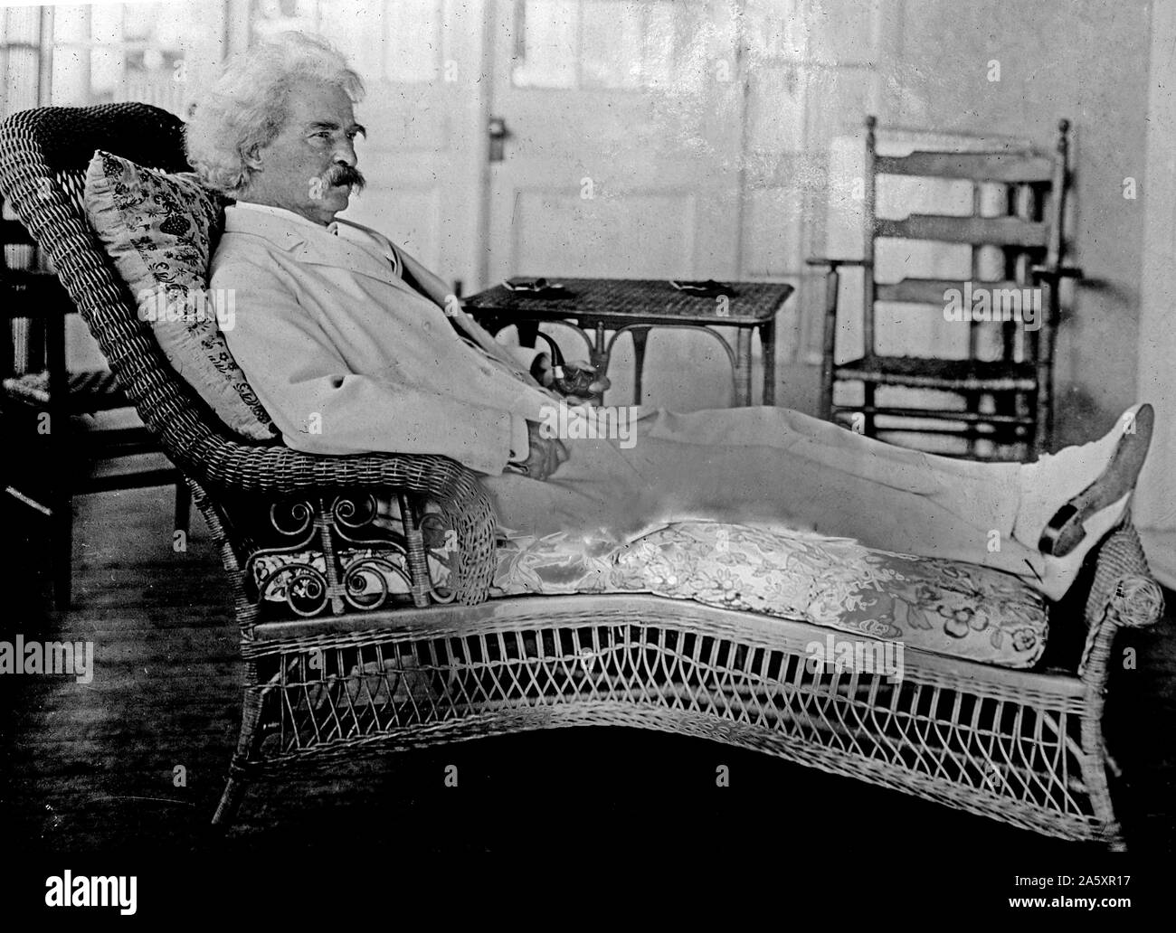 Samuel Clemens (Mark Twain) reclining in porch chair 4 15 1910 Stock ...