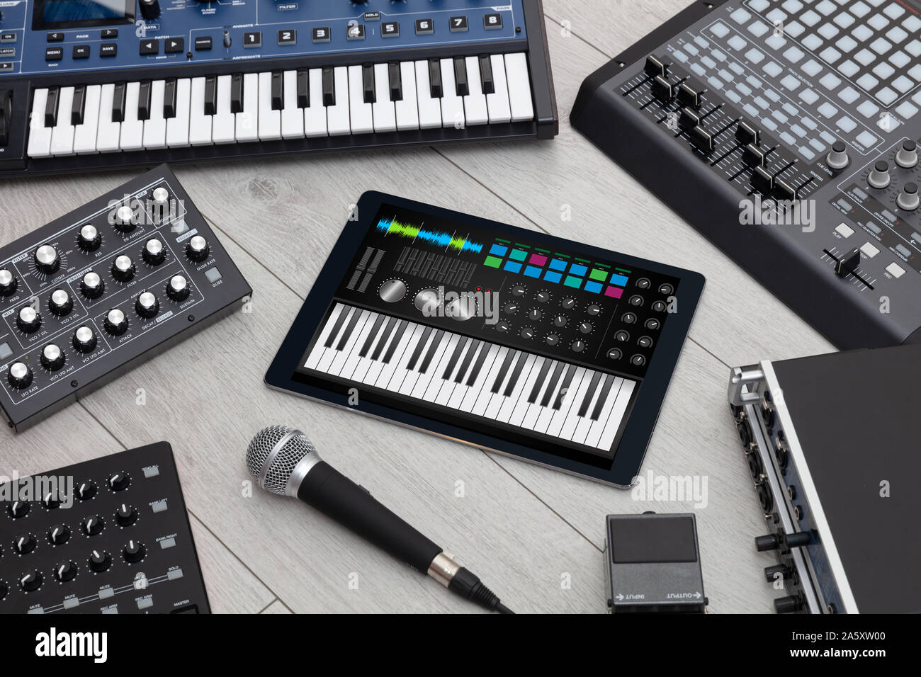 Piano synthesizer app on tablet and musical instrument concept Stock